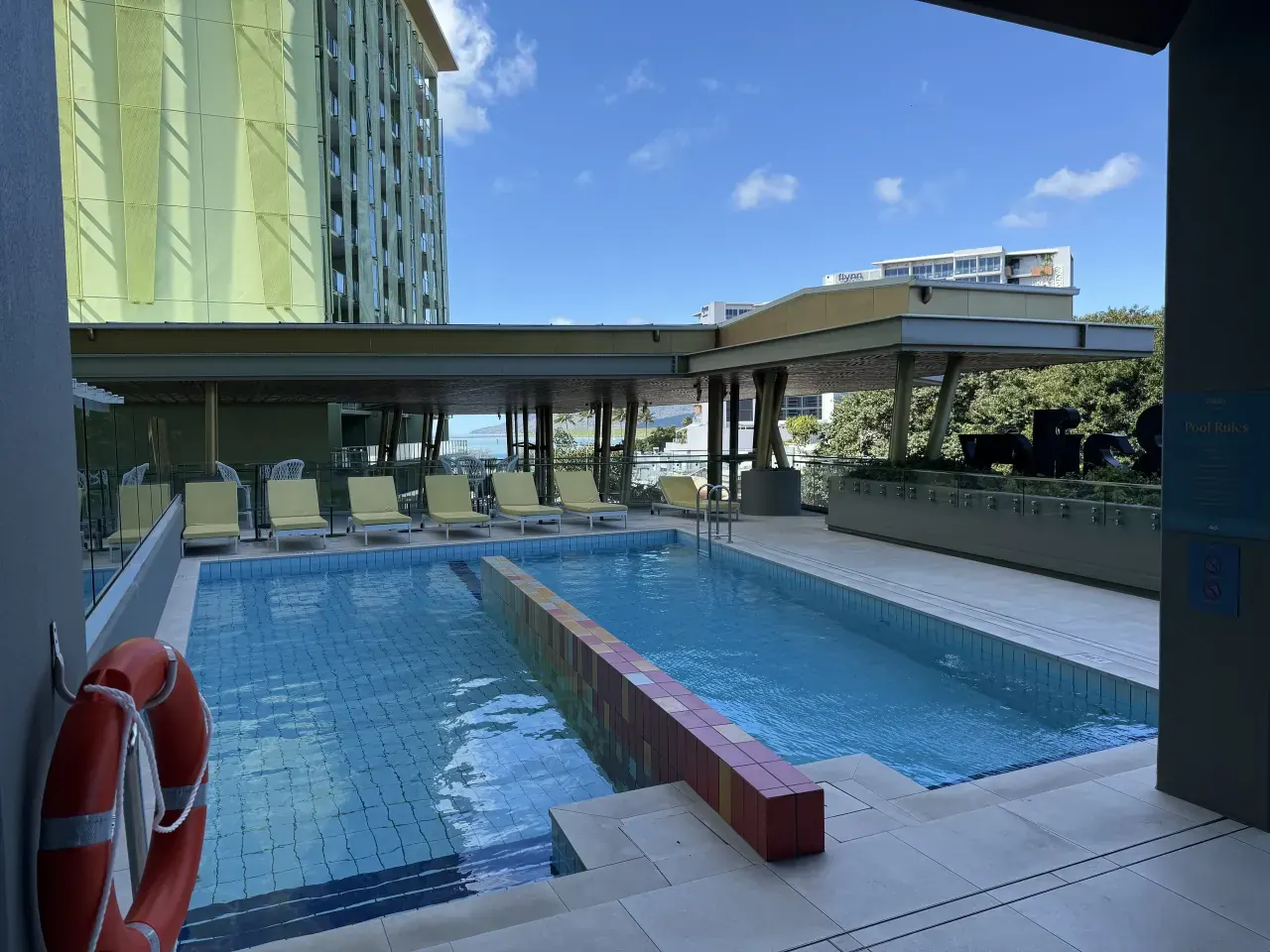 The hotel pool and lounge chairs