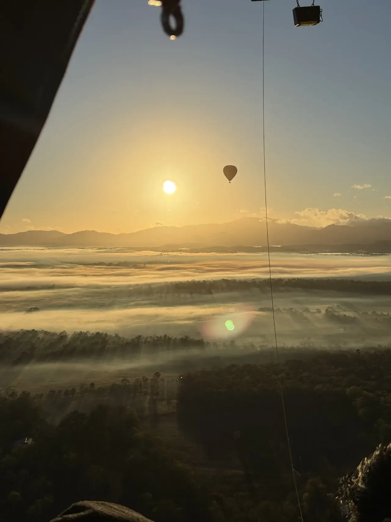 Another balloon and misty fields seen from our basket