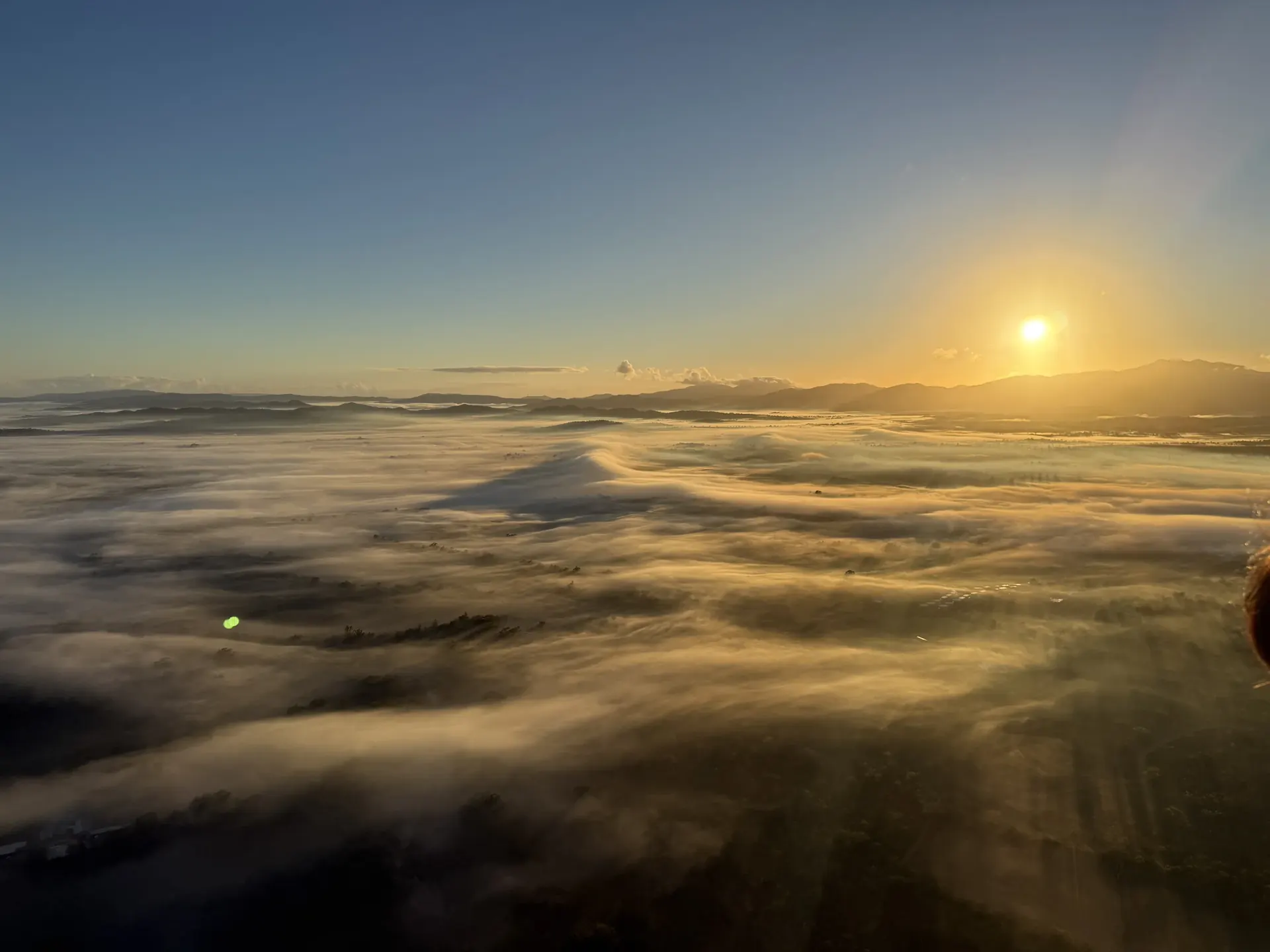 Sunlight over a sea of mist