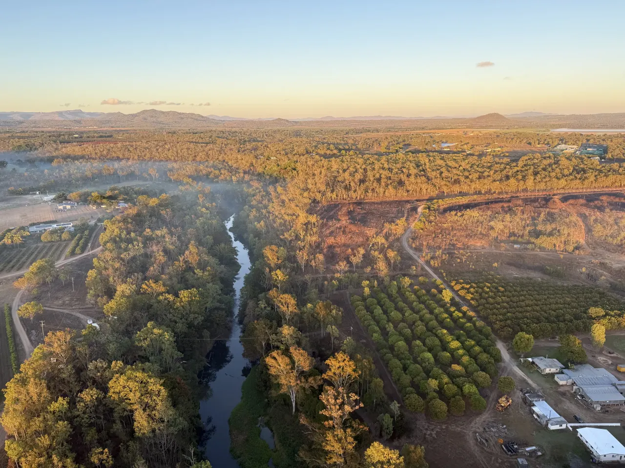 River and orchards below our balloon