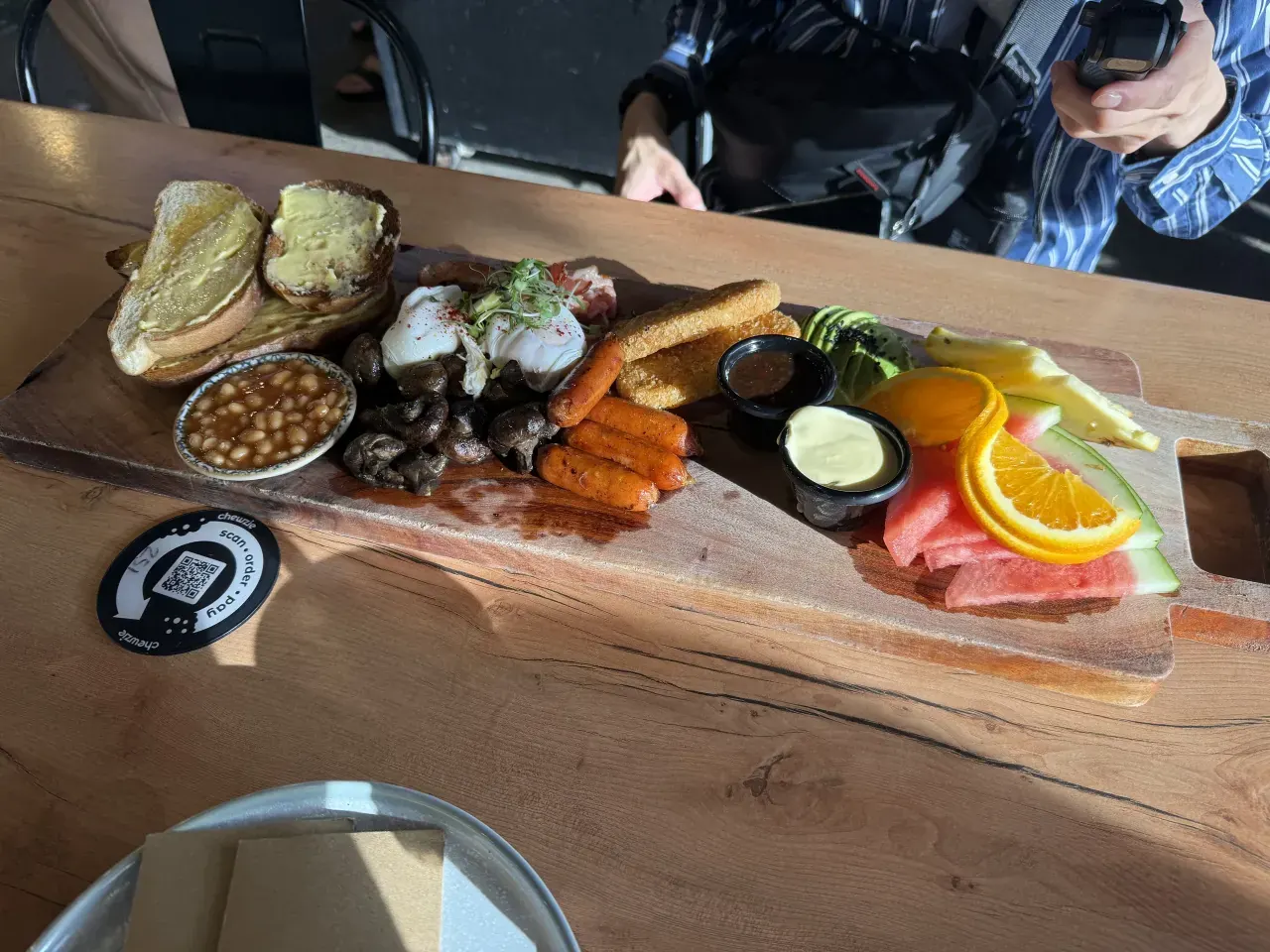 Eggs, toast, sausages and fruit at Muddy’s