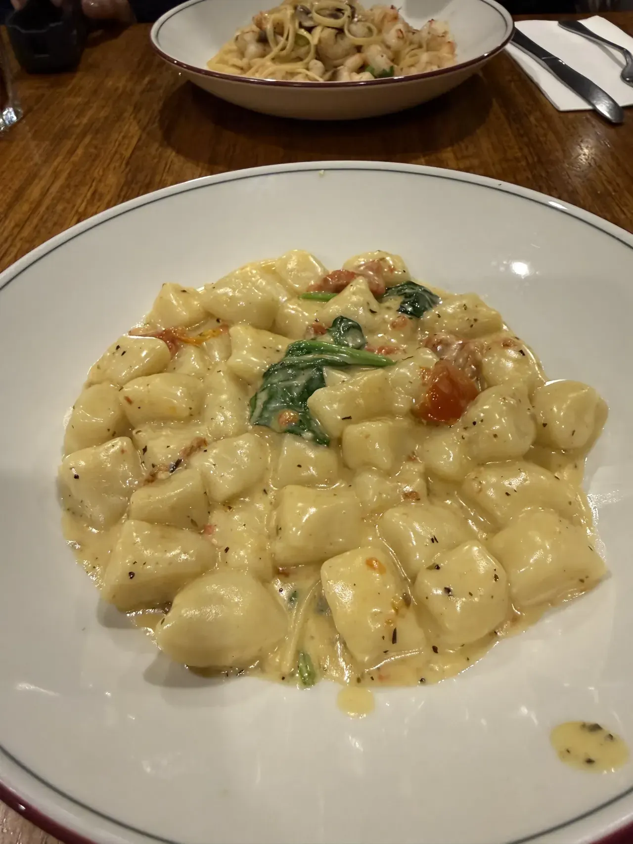 Creamy gnocchi with spinach and tomato at Villa Romana